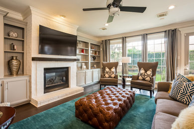 Example of a mid-sized transitional open concept medium tone wood floor and brown floor family room design in Houston with gray walls, a standard fireplace, a brick fireplace and a wall-mounted tv