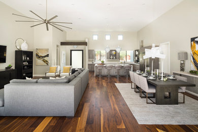 Mid-sized trendy enclosed medium tone wood floor and brown floor family room photo in Phoenix with gray walls