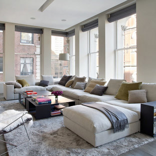 Family room - contemporary family room idea in New York with white walls