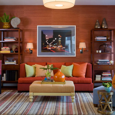 Trendy family room photo in New York with orange walls