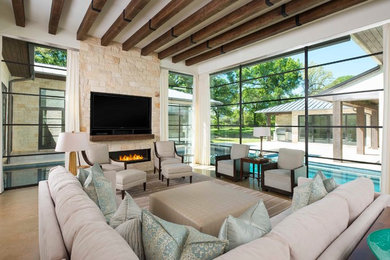 Inspiration for a huge modern open concept concrete floor family room remodel in Dallas with white walls, a ribbon fireplace, a stone fireplace and a media wall