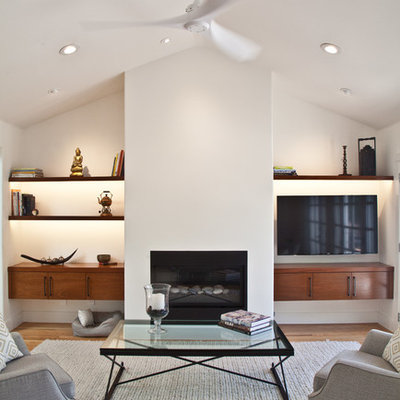 Family room - mid-sized contemporary open concept light wood floor family room idea in San Francisco with white walls, a ribbon fireplace, a plaster fireplace, a wall-mounted tv and a music area