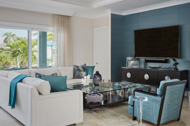 Example of a huge beach style open concept travertine floor and white floor family room design with white walls, no fireplace and a wall-mounted tv