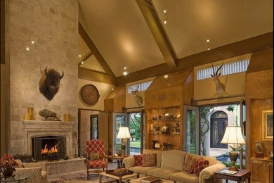 Inspiration for a huge timeless open concept travertine floor family room remodel in Houston with beige walls, a standard fireplace, a stone fireplace and no tv