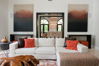 Trendy family room photo in Miami with beige walls