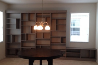 Large minimalist open concept carpeted family room library photo in Orlando with white walls, no fireplace and no tv