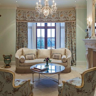 Family room - traditional enclosed family room idea in Toronto with green walls, a standard fireplace, a stone fireplace and no tv