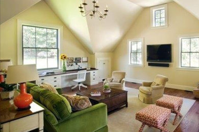 Family room - mid-sized country enclosed medium tone wood floor and red floor family room idea in Boston with beige walls and a wall-mounted tv