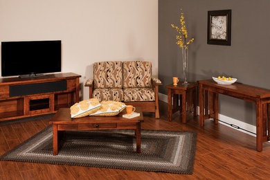 Example of a mid-sized classic open concept medium tone wood floor and brown floor family room design in Other with multicolored walls, no fireplace and a tv stand