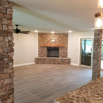 Created open areas with rock support columns.  Large corner rock fireplace.
