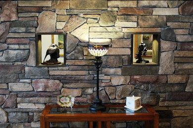 Example of a mid-sized mountain style enclosed family room library design in Other