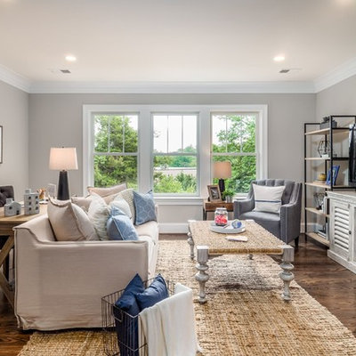 Inspiration for a large craftsman open concept dark wood floor and brown floor family room remodel in DC Metro with gray walls, no fireplace and a tv stand