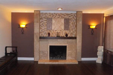 Example of a large classic dark wood floor family room design in Seattle with a standard fireplace and a stone fireplace