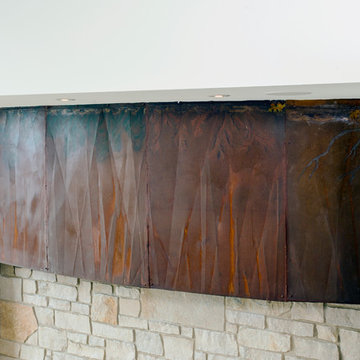 Custom Made Metal Television Shroud on Interior Stone Wall in Transitional Great