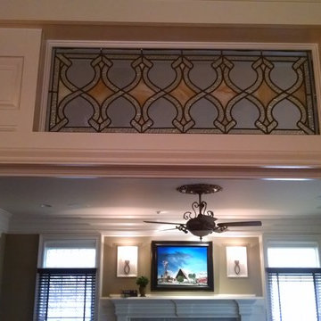 Custom Transom with millwork and original 1908 stained glass.