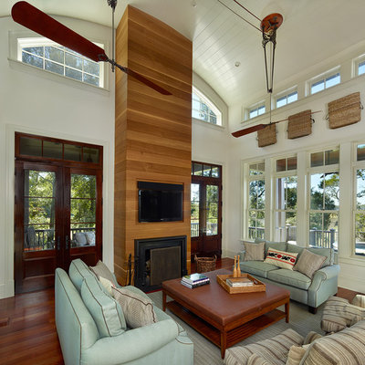 Family room - contemporary open concept family room idea in Charleston with a standard fireplace and a wall-mounted tv