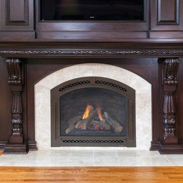 Dark Stained Cherry Cabinetry Surrounds Flush Hearth Stone Tile Fireplace