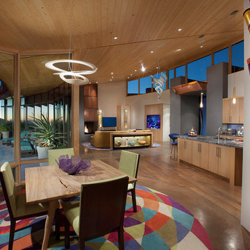 Dining area with a view and colorful art and area rug