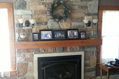 Elegant family room photo in Chicago with a standard fireplace