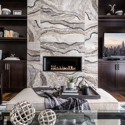 Family room library - mid-sized transitional enclosed dark wood floor family room library idea in Calgary with gray walls, a ribbon fireplace, a media wall and a tile fireplace