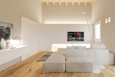 Example of a minimalist open concept family room design with a media wall