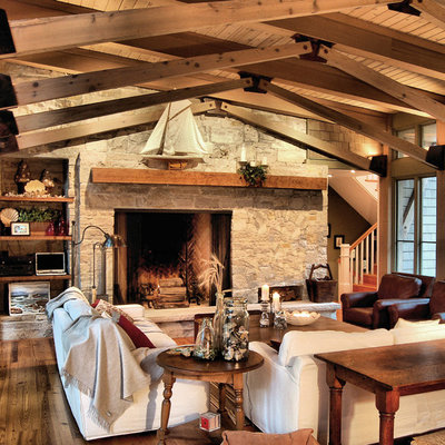 Example of a mountain style family room design in Chicago with a stone fireplace