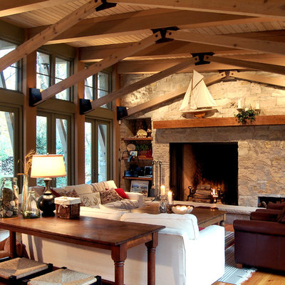 Inspiration for a rustic family room remodel in Chicago with a stone fireplace