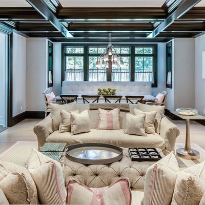 Example of a large classic enclosed light wood floor family room design in New York with no fireplace, no tv and white walls