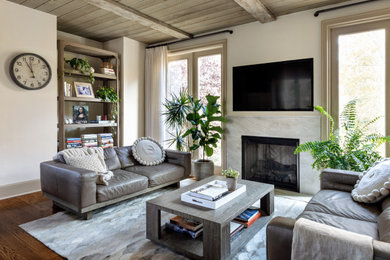 Example of a mid-sized transitional open concept brown floor and dark wood floor family room design in New York with a standard fireplace, a stone fireplace, white walls and a wall-mounted tv