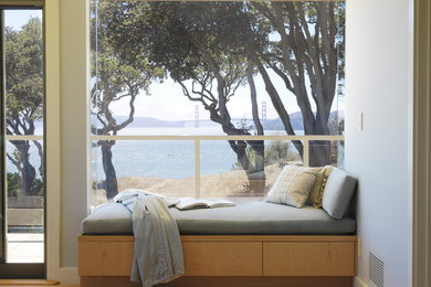 Family room - modern light wood floor family room idea in San Francisco with gray walls