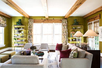 Family room - mid-sized eclectic enclosed dark wood floor and brown floor family room idea with green walls, a standard fireplace, a stone fireplace and a wall-mounted tv