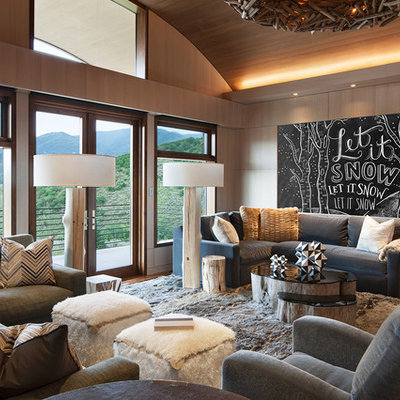 Family room - huge rustic family room idea in Denver with beige walls and no fireplace