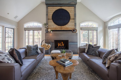 Inspiration for a mid-sized modern medium tone wood floor family room remodel in Chicago with a standard fireplace, a metal fireplace and a wall-mounted tv