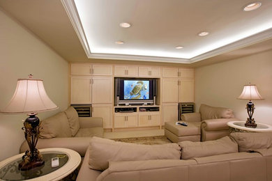 Family room - contemporary enclosed carpeted family room idea in Hawaii with beige walls and a media wall