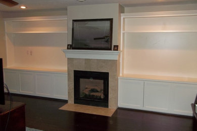 Example of a large transitional open concept dark wood floor and brown floor family room design in Grand Rapids with white walls, a standard fireplace and a tile fireplace