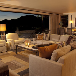 Island style open concept family room photo in Atlanta with beige walls