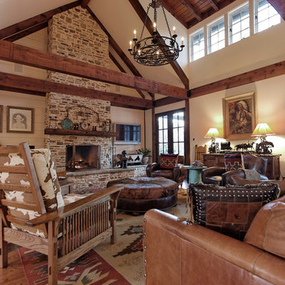 Inspiration for a rustic family room remodel in Atlanta with a stone fireplace