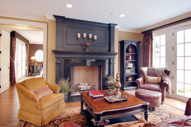 Arts and crafts open concept medium tone wood floor family room photo in Chicago with a stone fireplace
