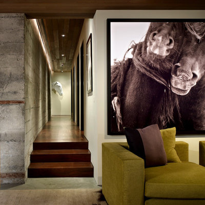 Family room - mid-sized contemporary enclosed concrete floor and gray floor family room idea in Seattle with beige walls