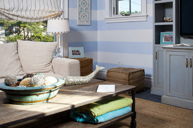 Example of a beach style family room design in Portland Maine