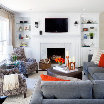Example of a mid-sized transitional open concept brown floor and dark wood floor family room design in DC Metro with beige walls, a standard fireplace, a tile fireplace and a wall-mounted tv