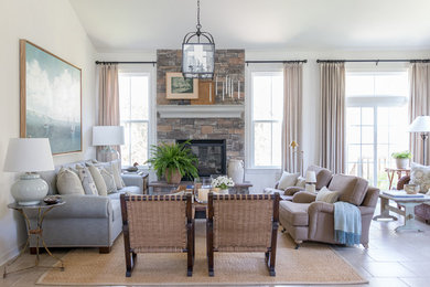Large transitional open concept family room photo in New York with white walls and a stone fireplace
