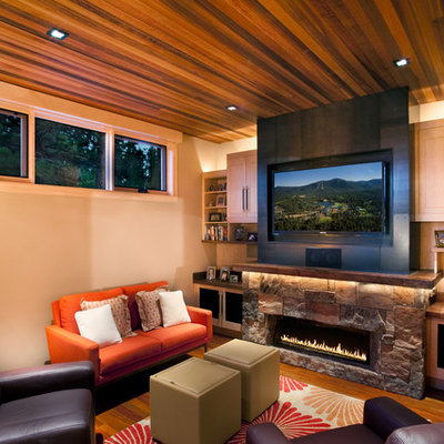 Example of a mountain style family room design in Sacramento with a stone fireplace