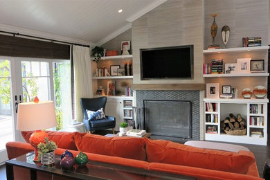 Example of a large minimalist open concept dark wood floor, brown floor, shiplap ceiling and wallpaper family room design in Orange County with gray walls, a standard fireplace, a tile fireplace and a media wall