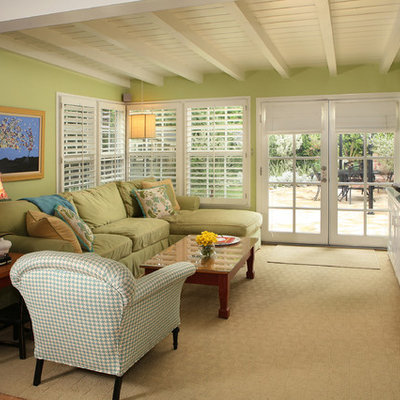 Family room - contemporary family room idea in Los Angeles with green walls