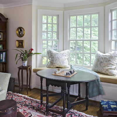 Inspiration for a victorian dark wood floor family room remodel in Richmond with beige walls