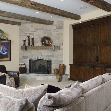 Family Room with Floor to Ceiling Raised Hearth Stone Fireplace
