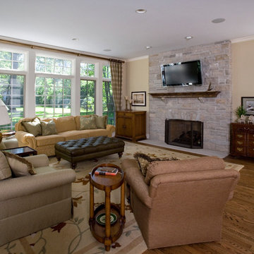 Family Room with Floor to Ceiling Stone Flush Hearth Fireplace
