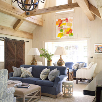 Family Room with high ceilings and wood beams