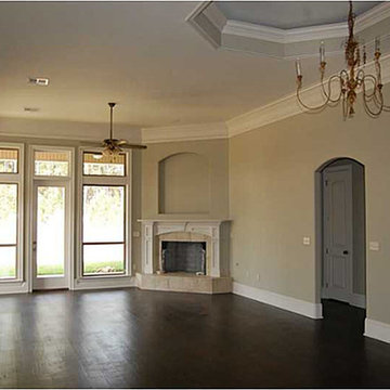 Family room with ornately design fireplace